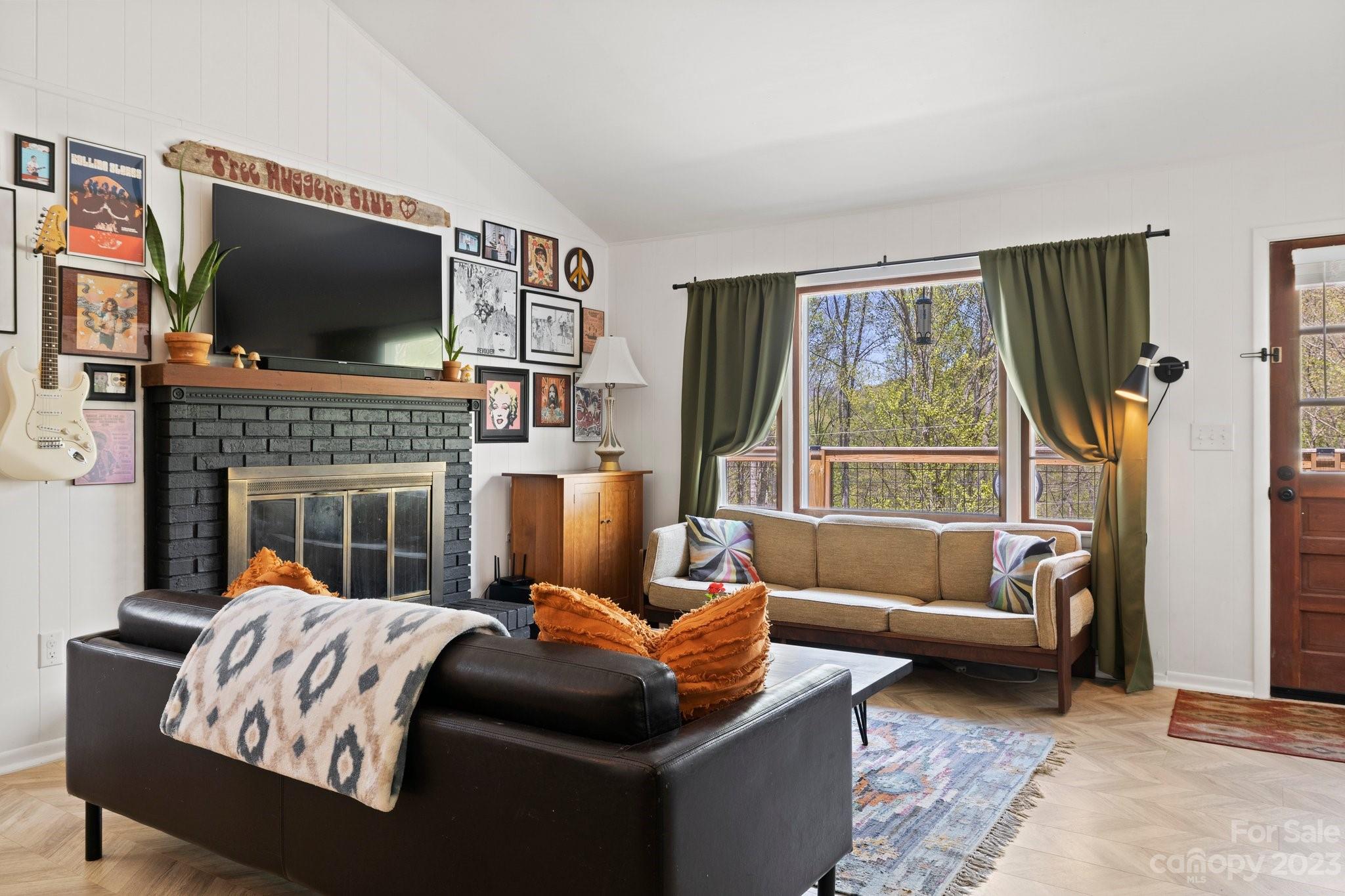 316 Rules Run Road Clyde, NC 28721 - Photo 12 of 47 a living room with furniture fireplace and flat screen tv