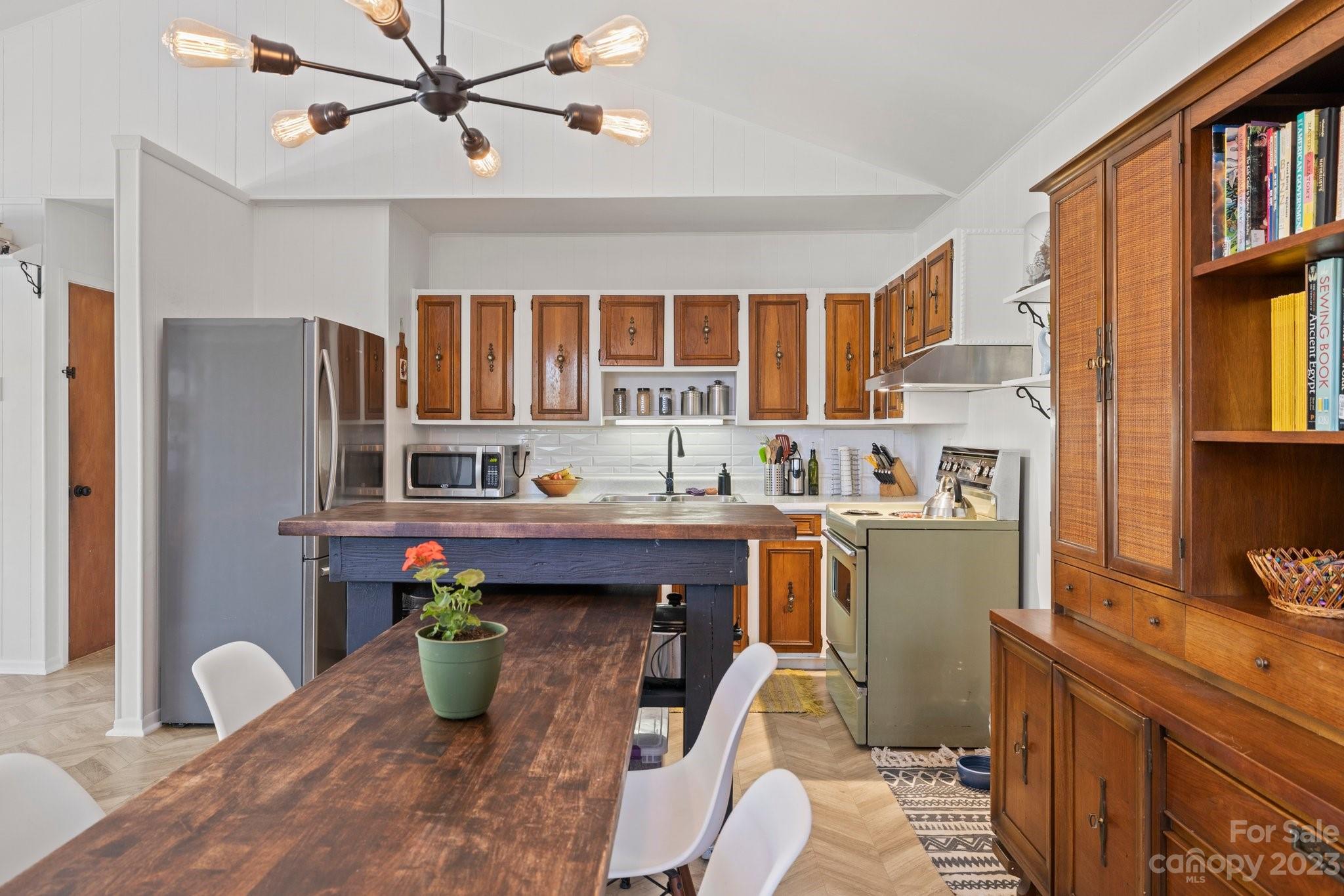 316 Rules Run Road Clyde, NC 28721 - Photo 17 of 47 a kitchen with a refrigerator and a sink