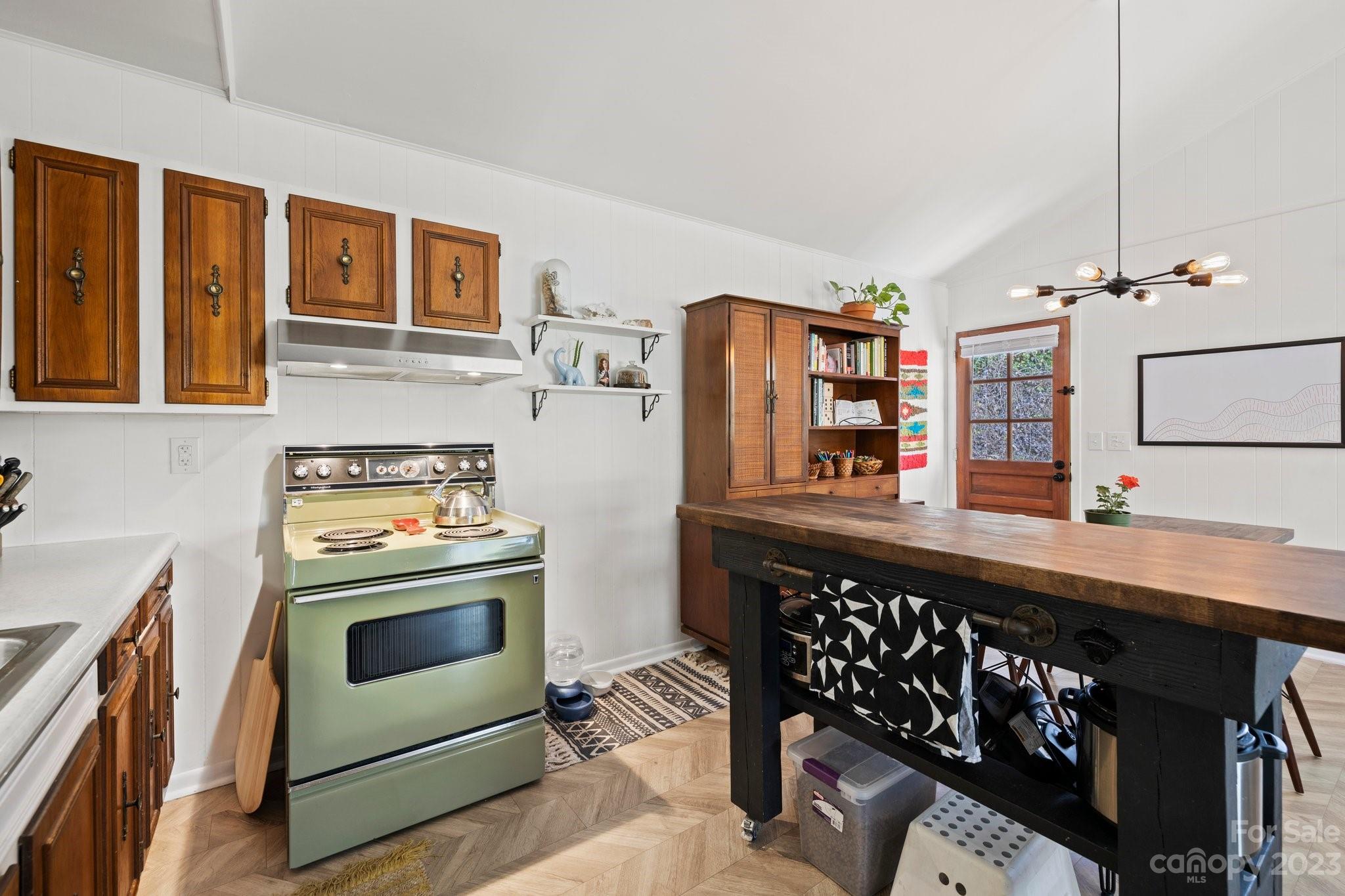 316 Rules Run Road Clyde, NC 28721 - Photo 20 of 47 a kitchen with stainless steel appliances granite countertop a stove a sink and a refrigerator