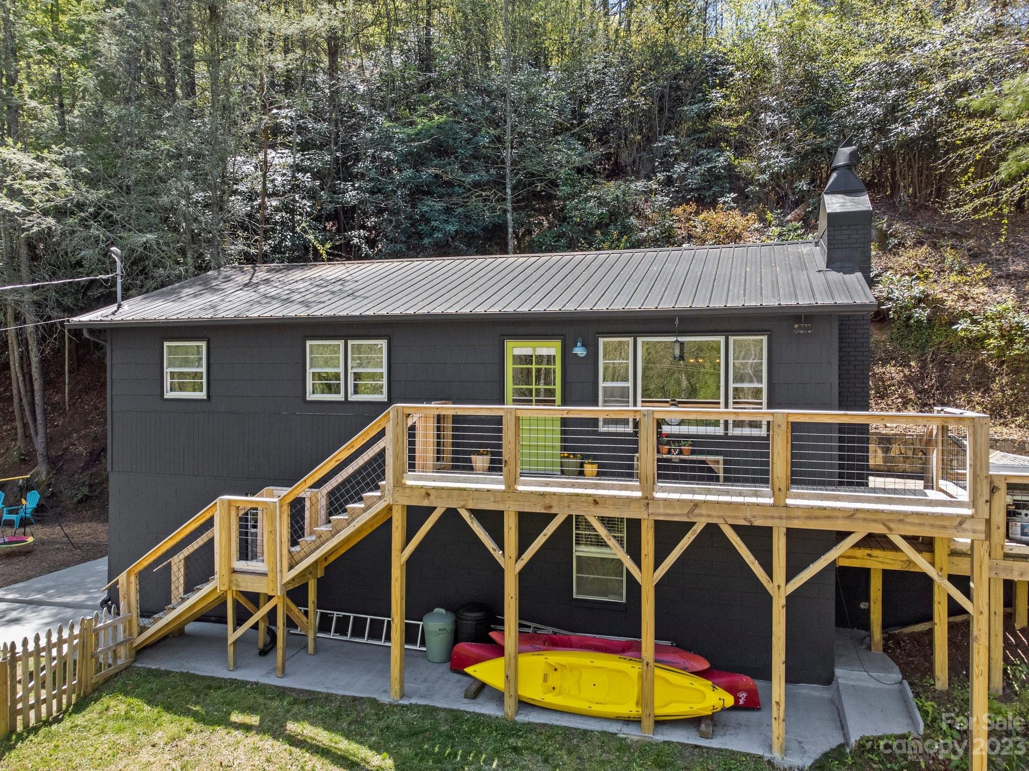 316 Rules Run Road Clyde, NC 28721 - Photo 2 of 47 an aerial view of a house with swimming pool and porch