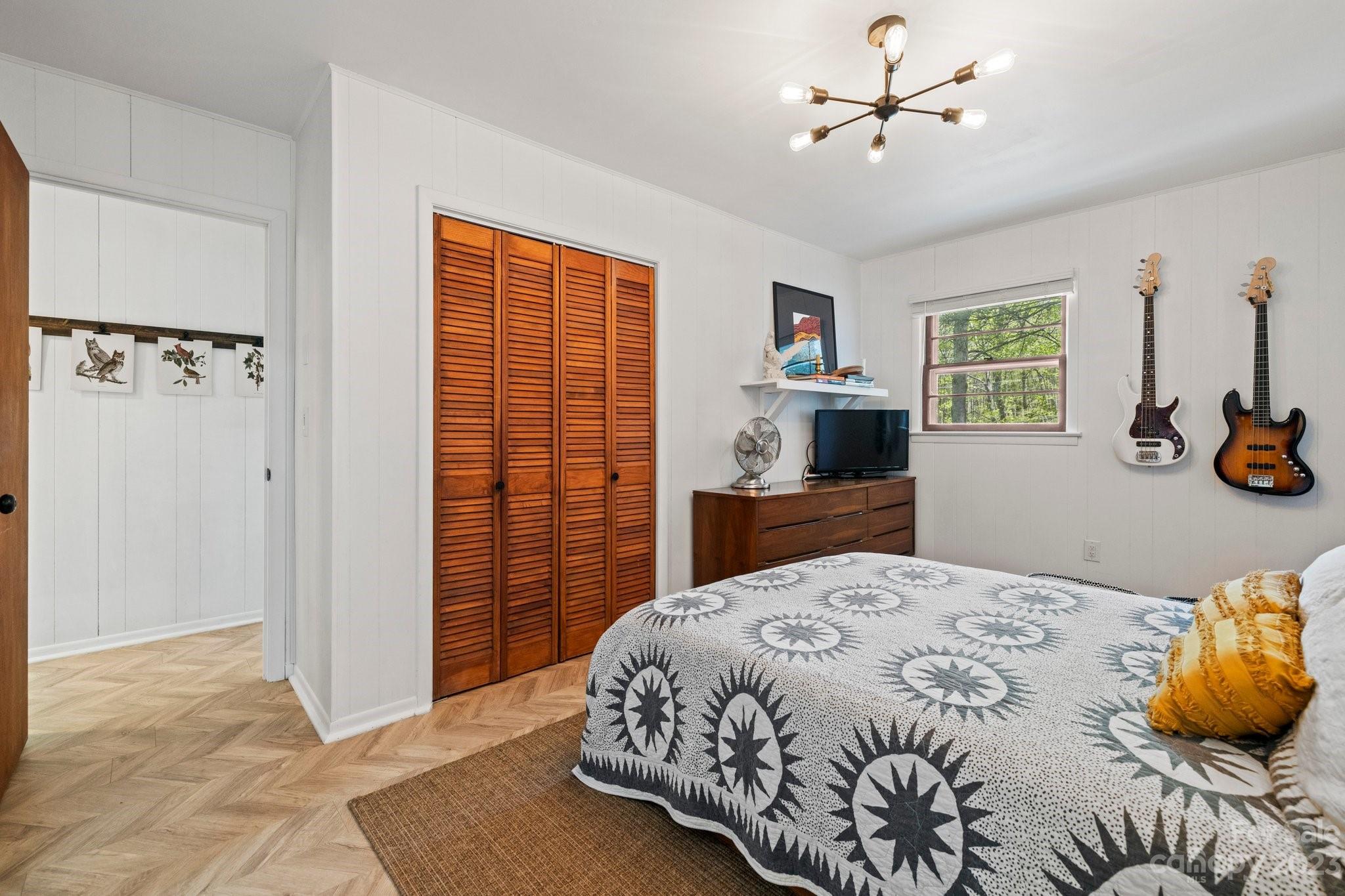 316 Rules Run Road Clyde, NC 28721 - Photo 23 of 47 a bedroom with a bed and dresser