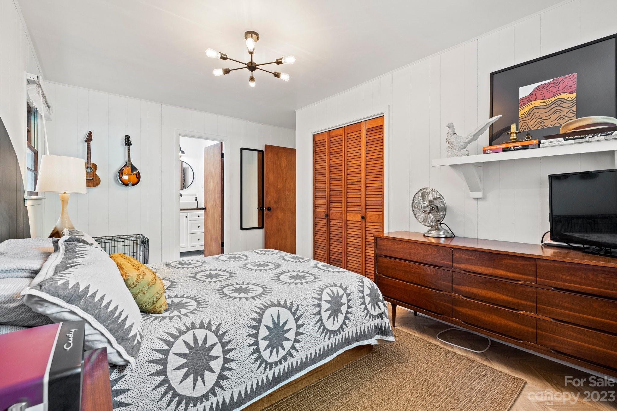 316 Rules Run Road Clyde, NC 28721 - Photo 24 of 47 a bedroom with a bed and a flat screen tv