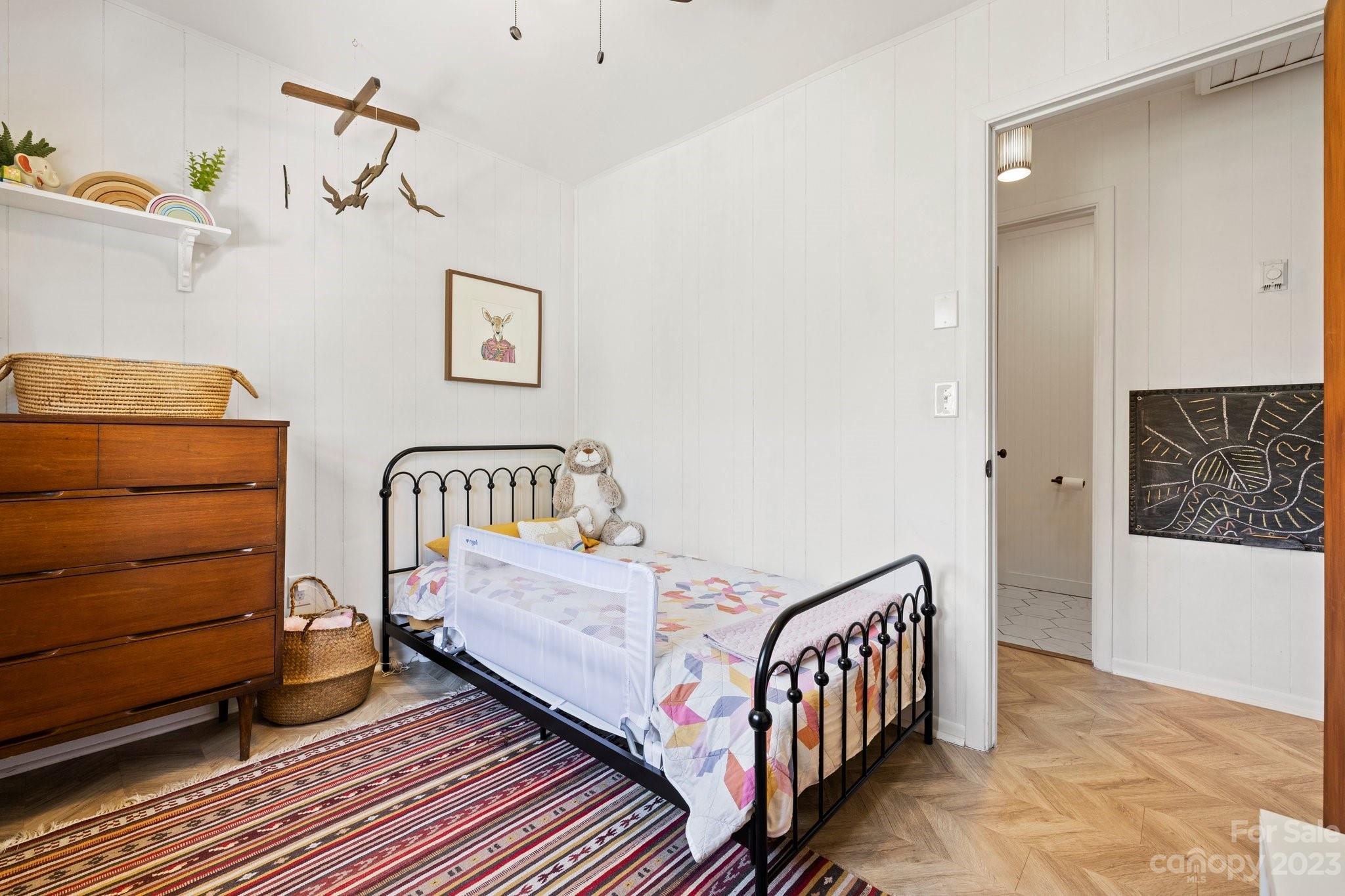 316 Rules Run Road Clyde, NC 28721 - Photo 27 of 47 a bedroom with furniture and a baby crib