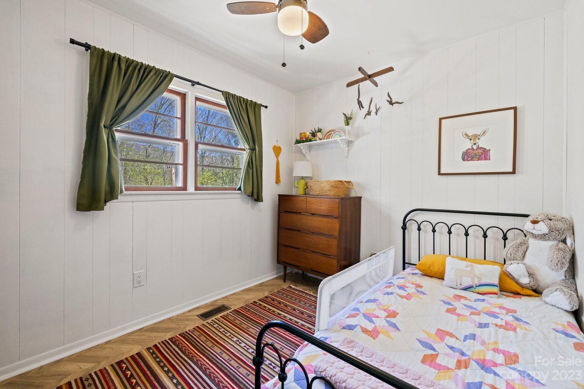 316 Rules Run Road Clyde, NC 28721 - Photo 28 of 47 a bedroom with a bed and a painting on the wall