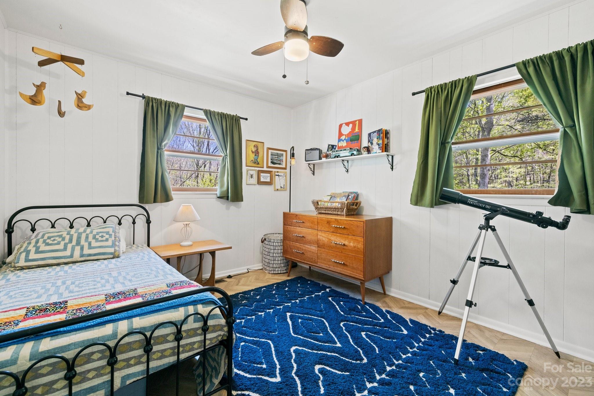 316 Rules Run Road Clyde, NC 28721 - Photo 30 of 47 a bedroom with furniture and a window