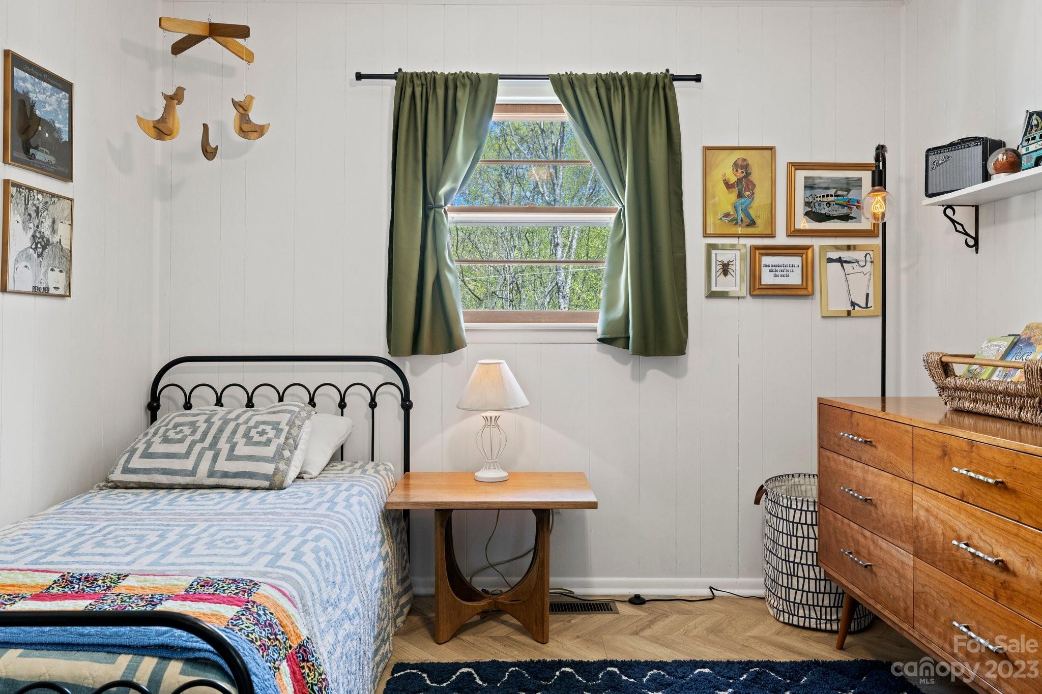 316 Rules Run Road Clyde, NC 28721 - Photo 31 of 47 a bedroom with a bed and wooden floor