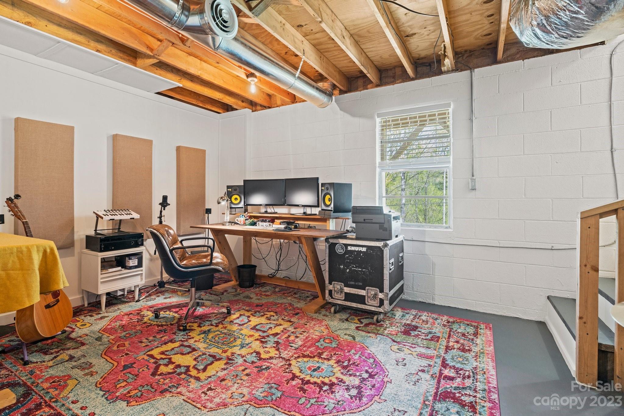 316 Rules Run Road Clyde, NC 28721 - Photo 34 of 47 a workspace room with furniture a rug and a window
