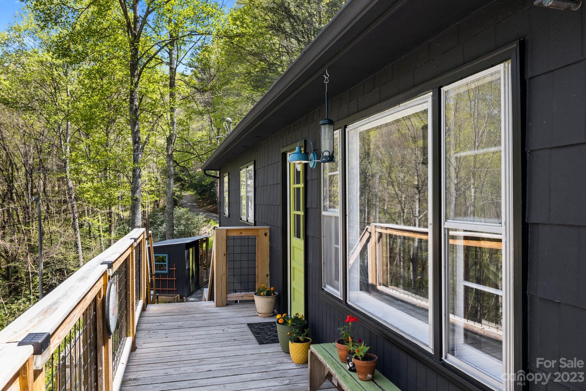 316 Rules Run Road Clyde, NC 28721 - Photo 5 of 47 a view of a balcony with wooden floor
