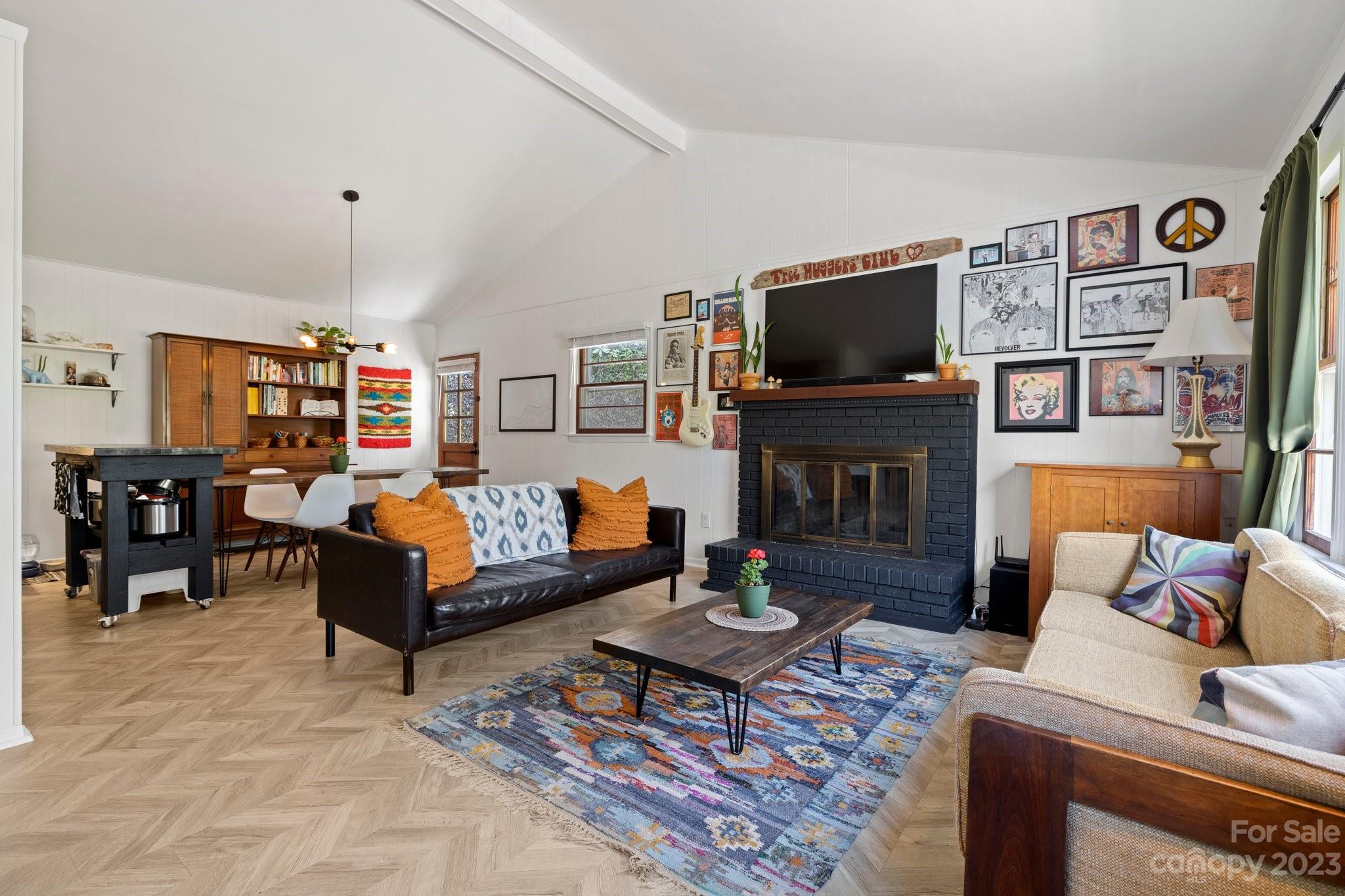316 Rules Run Road Clyde, NC 28721 - Photo 8 of 47 a living room with furniture and a flat screen tv