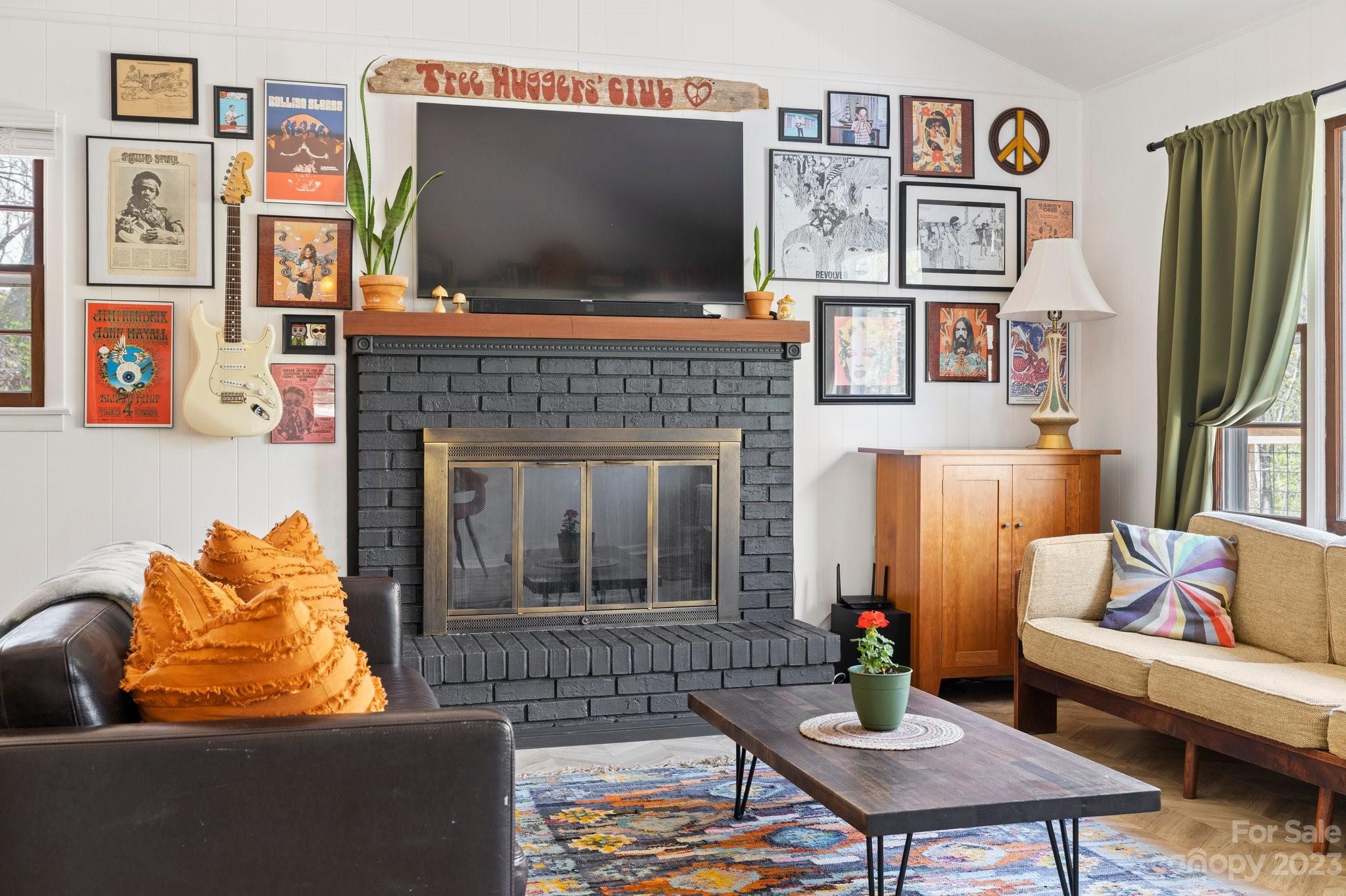 316 Rules Run Road Clyde, NC 28721 - Photo 9 of 47 a living room with furniture and a flat screen tv