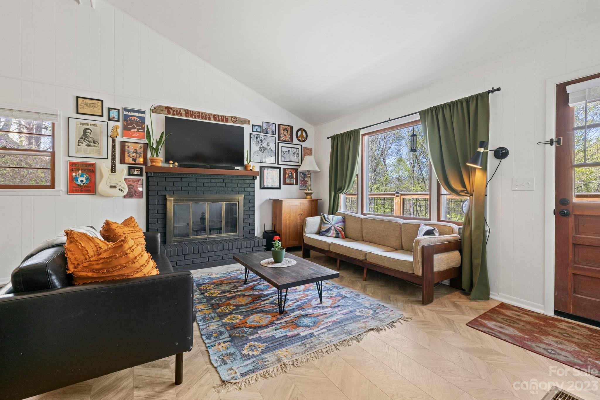 316 Rules Run Road Clyde, NC 28721 - Photo 10 of 47 a living room with fireplace furniture and a flat screen tv