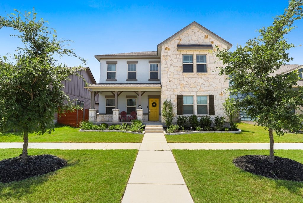 a front view of a house with a yard