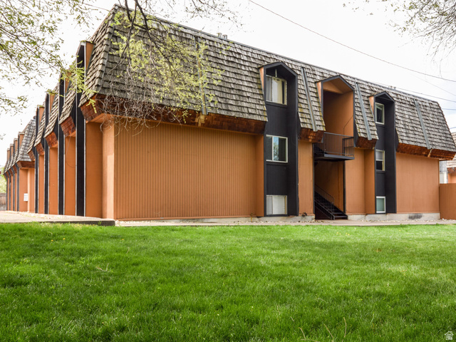 240 East 400 North, Unit 26 Logan, UT 84321 - Photo 1 of 10 Back of house with mansard roof and a lawn