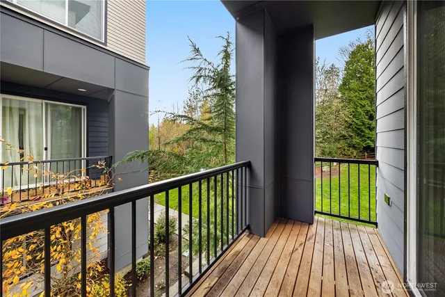 a view of balcony with wooden floor