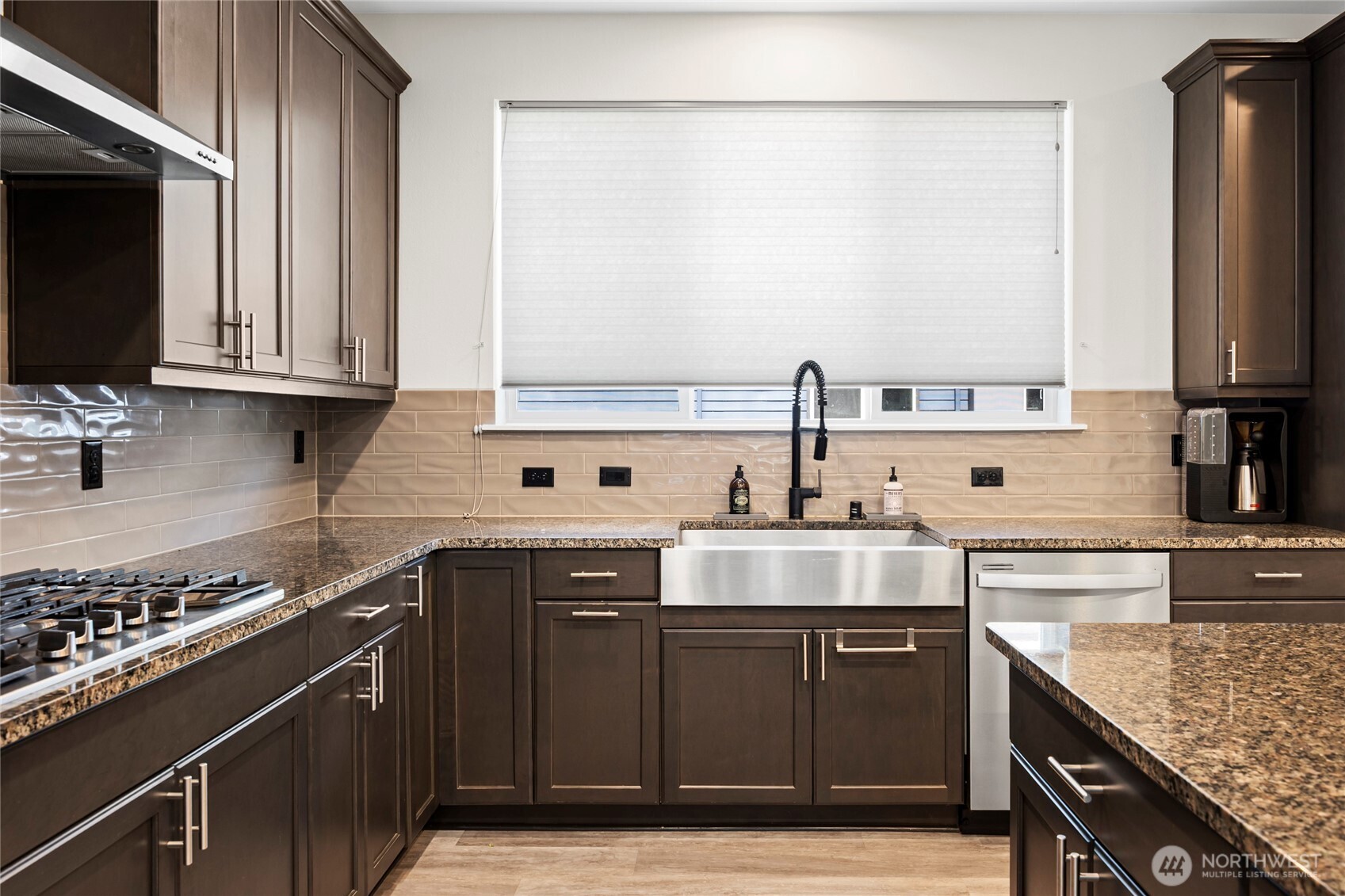 508 237th Street Southeast, Unit E Bothell, WA 98021 - Photo 15 of 35 a kitchen with stainless steel appliances granite countertop a sink stove and refrigerator
