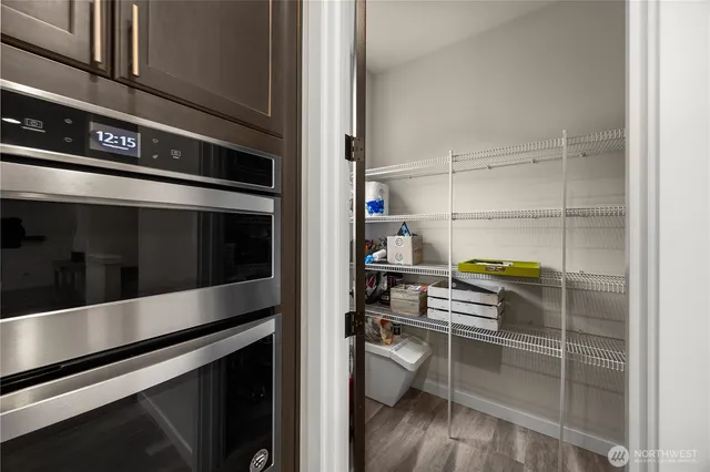 a kitchen with a stove and a refrigerator