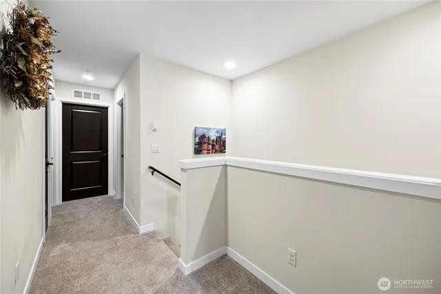 a view of a hallway with an empty room