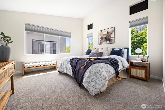 a bedroom with a bed and a couch