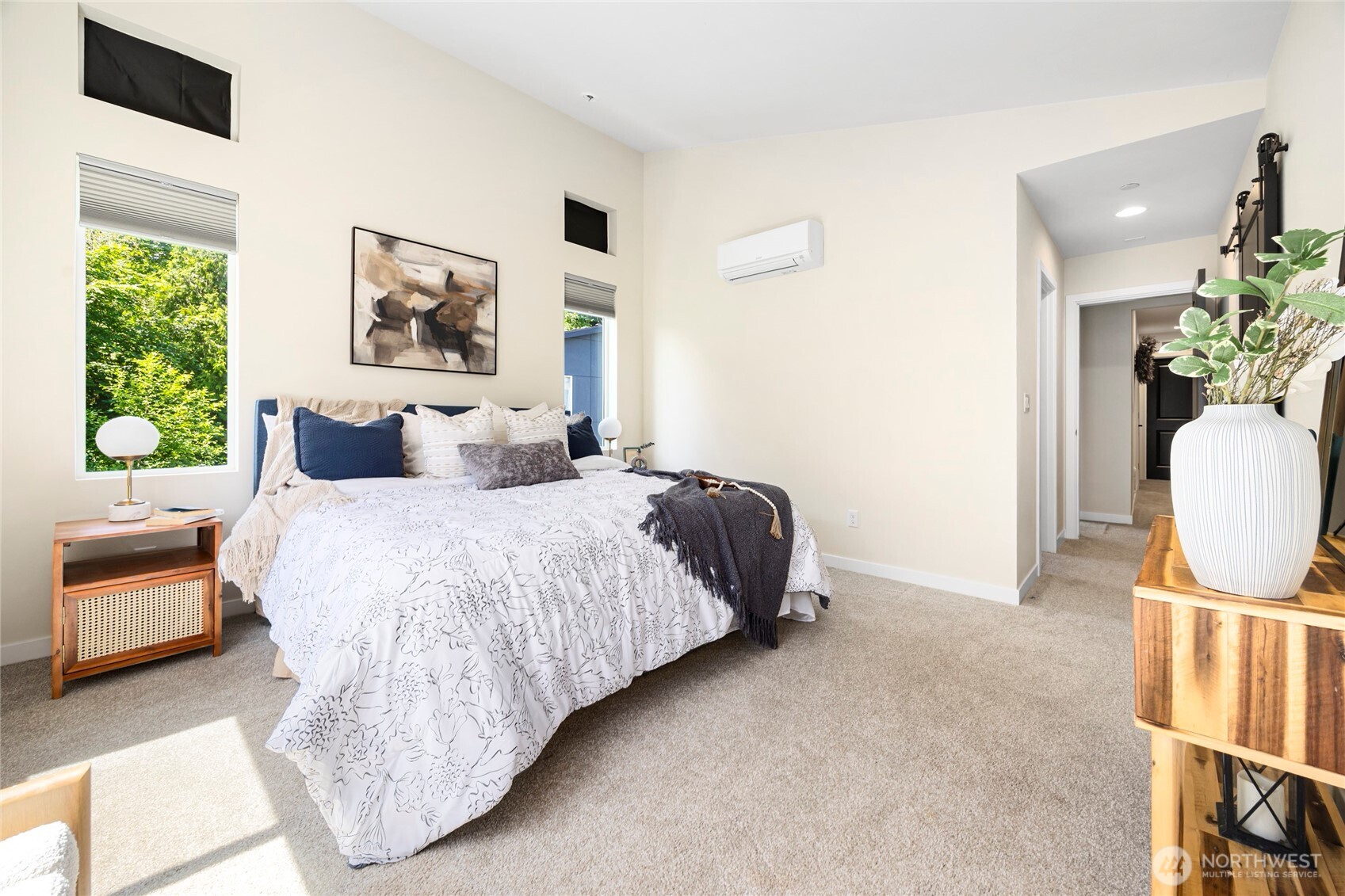 508 237th Street Southeast, Unit E Bothell, WA 98021 - Photo 22 of 35 a bedroom with a bed a couch and a potted plant