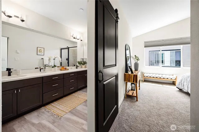 a spacious bathroom with a double vanity sink and a mirror