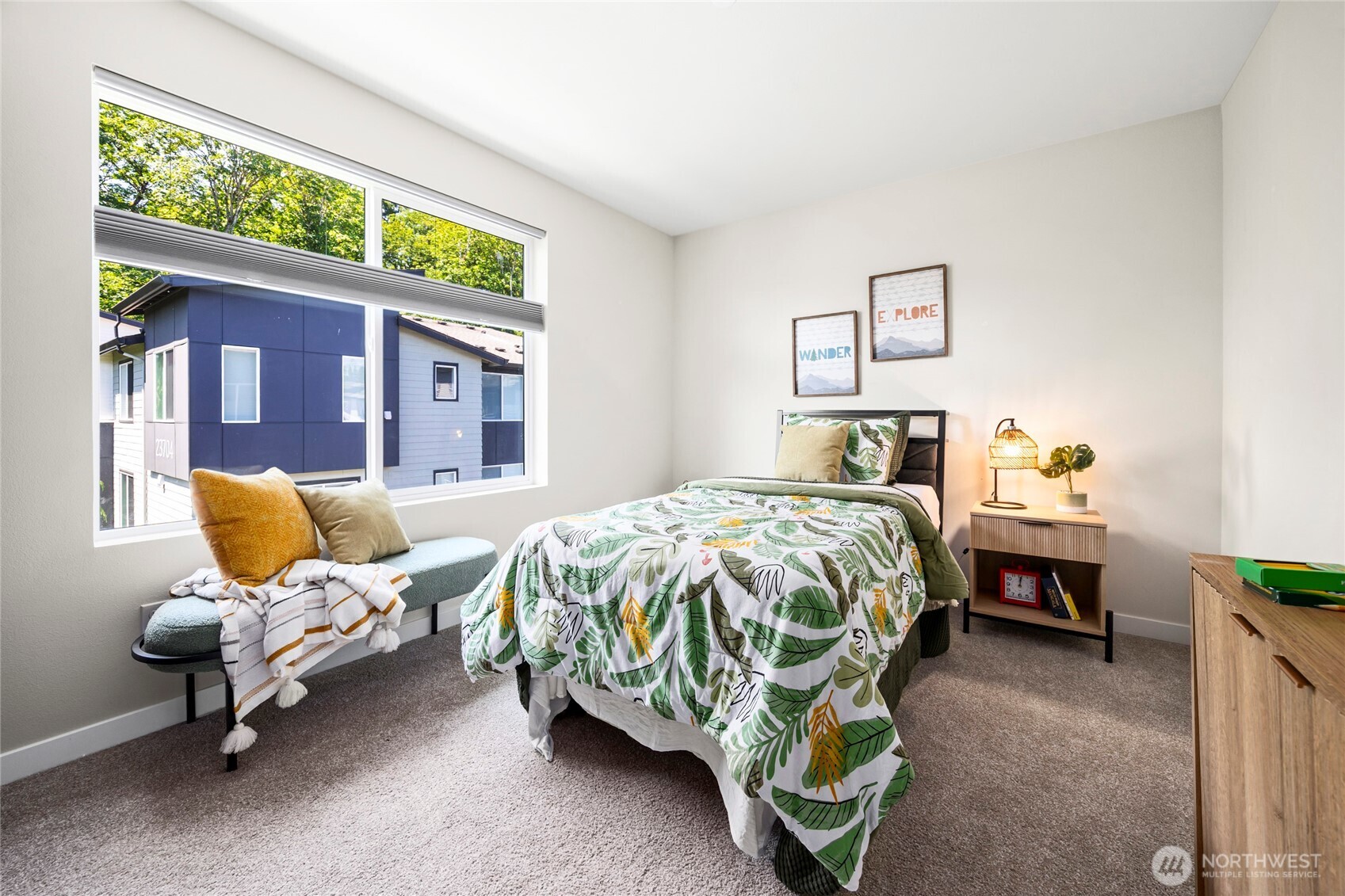 508 237th Street Southeast, Unit E Bothell, WA 98021 - Photo 26 of 35 a bedroom with a bed and chair