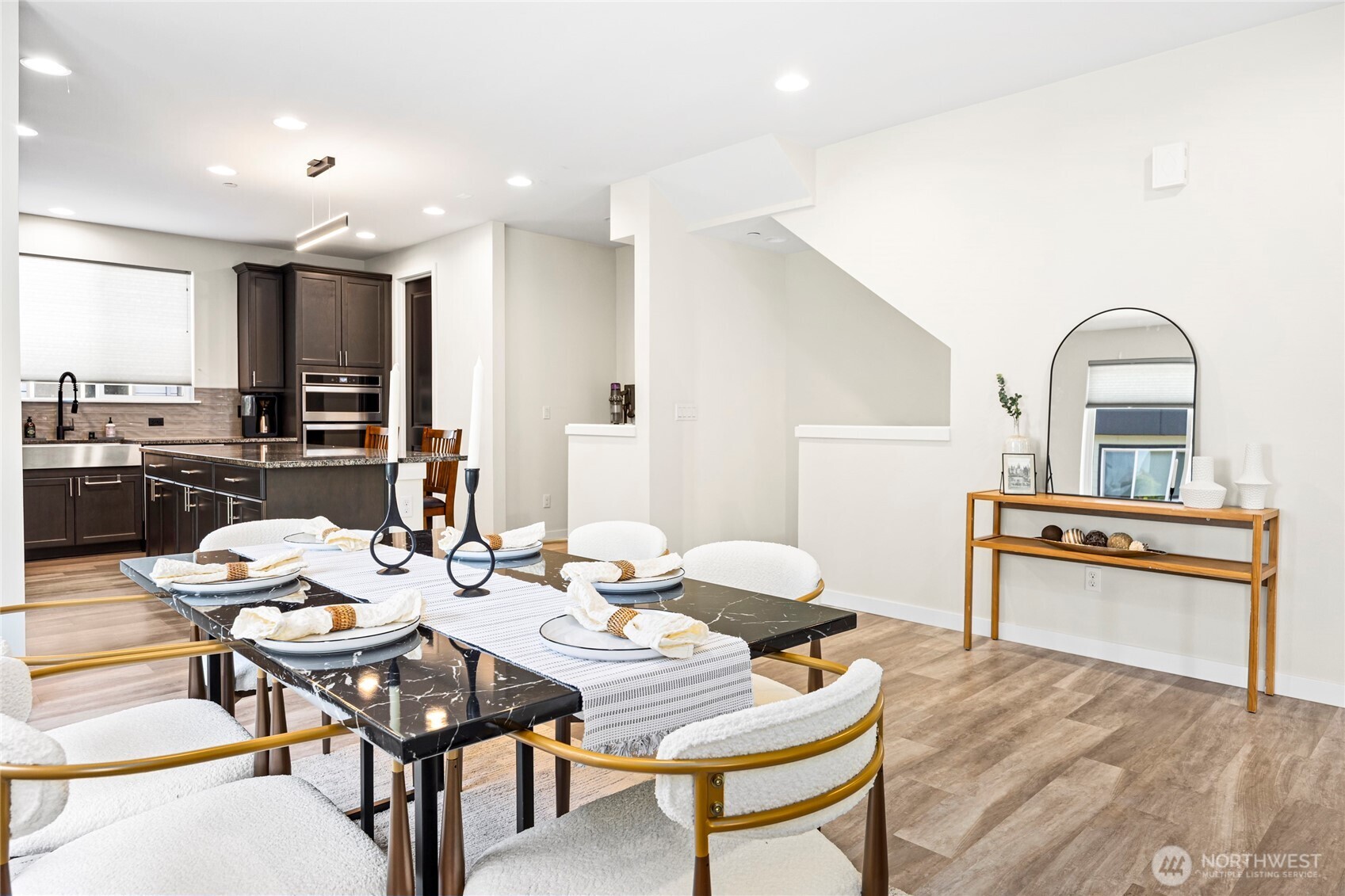 508 237th Street Southeast, Unit E Bothell, WA 98021 - Photo 5 of 35 a view of a dining room with furniture and wooden floor