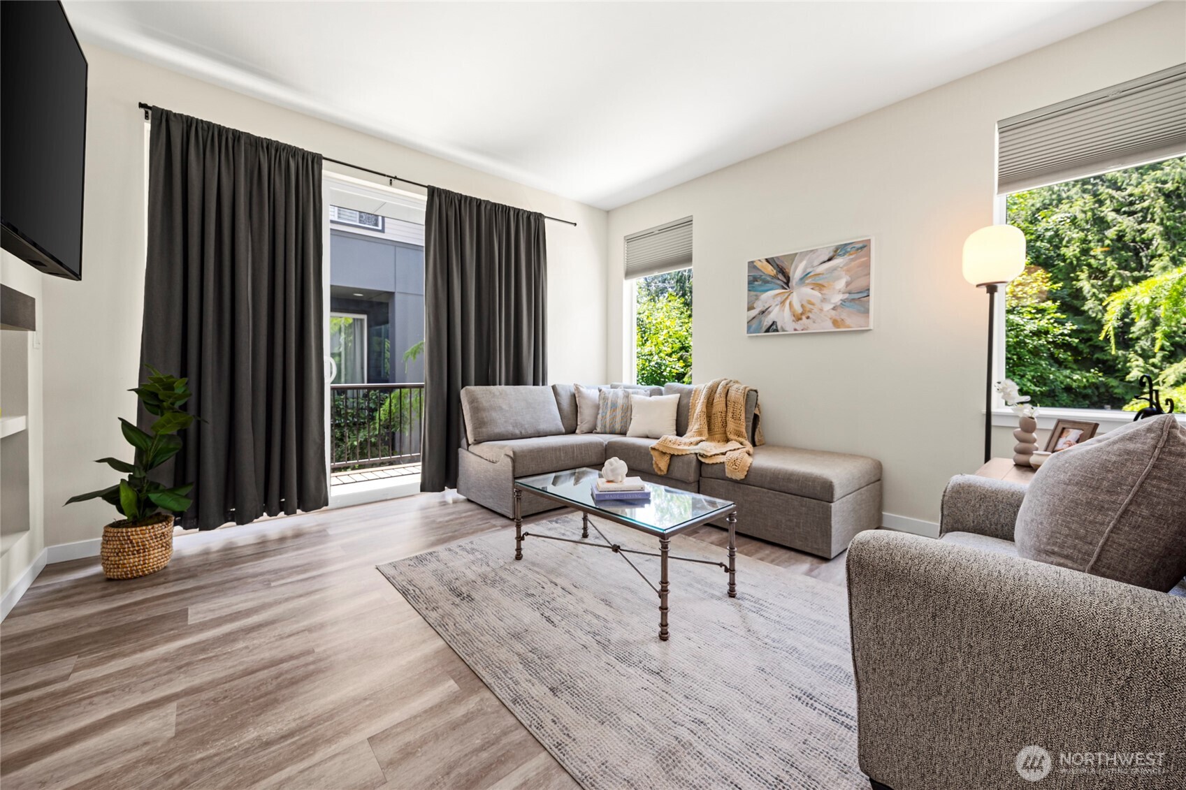 508 237th Street Southeast, Unit E Bothell, WA 98021 - Photo 7 of 35 a living room with furniture and a potted plant