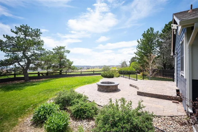 a view of a garden with lawn chairs