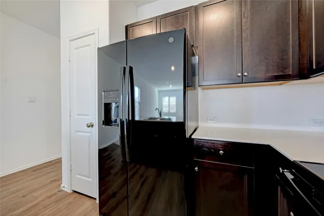 a kitchen with stainless steel appliances a sink stove and refrigerator