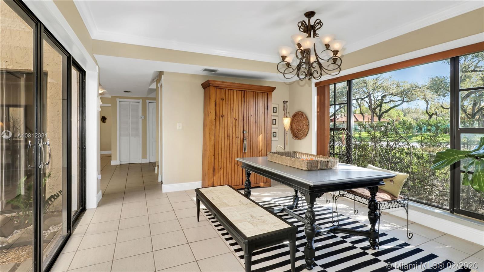 11339 Southwest 74th Terrace Miami, FL 33173 - Photo 11 of 31 DINING ROOM WITH FULL VIEW OF ATRIUM TO THE LEFT