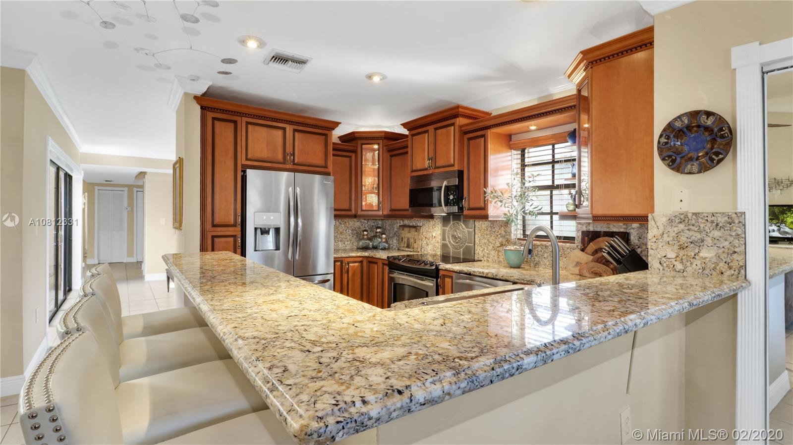 11339 Southwest 74th Terrace Miami, FL 33173 - Photo 12 of 31 KITCHEN AND COUNTER SEATING AREA