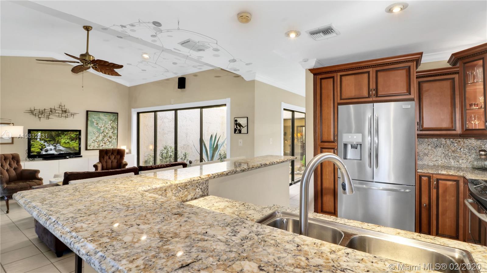 11339 Southwest 74th Terrace Miami, FL 33173 - Photo 13 of 31 VIEW FROM KITCHEN TO FAMILY ROOM