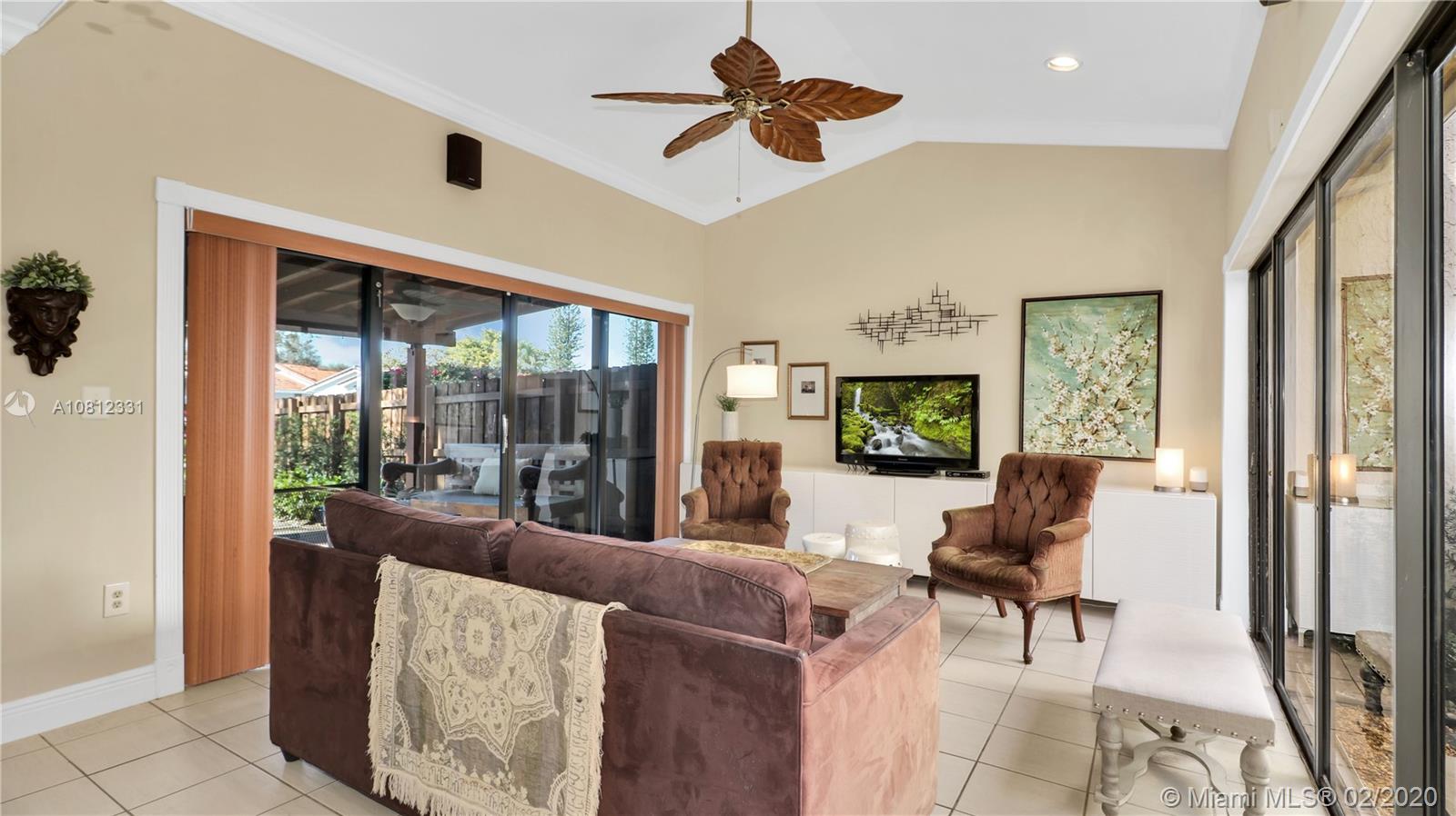 11339 Southwest 74th Terrace Miami, FL 33173 - Photo 15 of 31 FAMILY ROOM WITH ACCESS TO OUTSIDE PATIO AREA