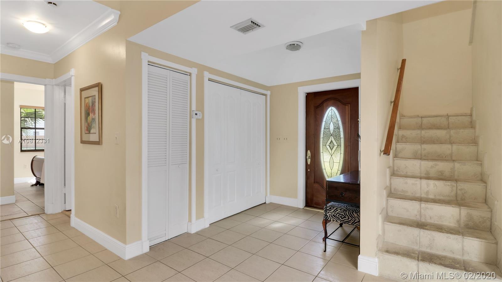 11339 Southwest 74th Terrace Miami, FL 33173 - Photo 21 of 31 FOYER ENTRANCE AND STAIRS TO SECOND FLOOR
