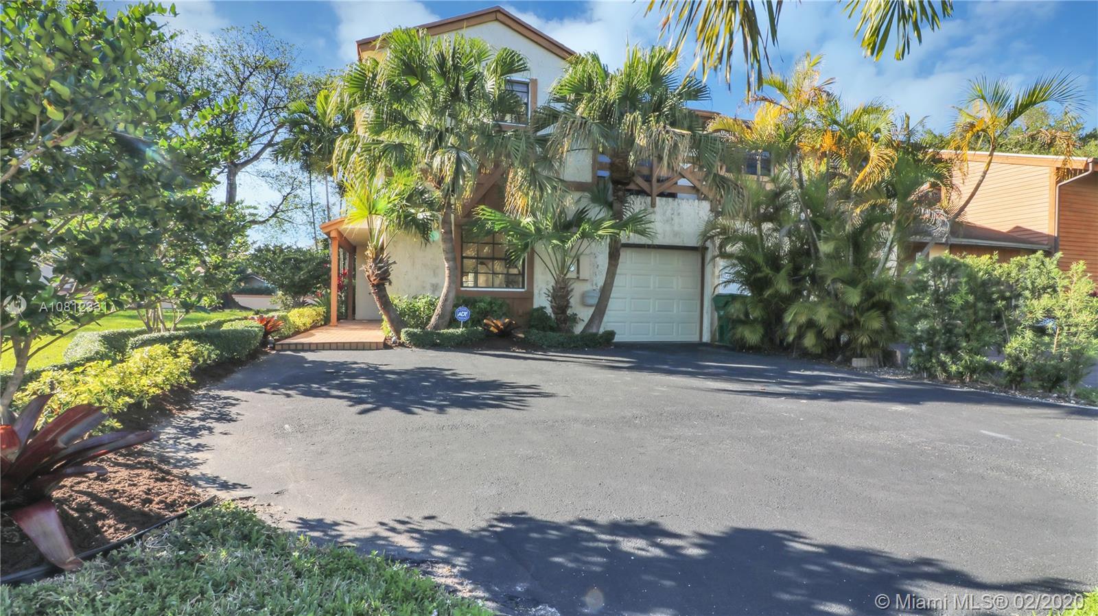 11339 Southwest 74th Terrace Miami, FL 33173 - Photo 4 of 31 SIDE OF HOUSE - GARAGE ENTRANCE AND DRIVEWAY PARKING