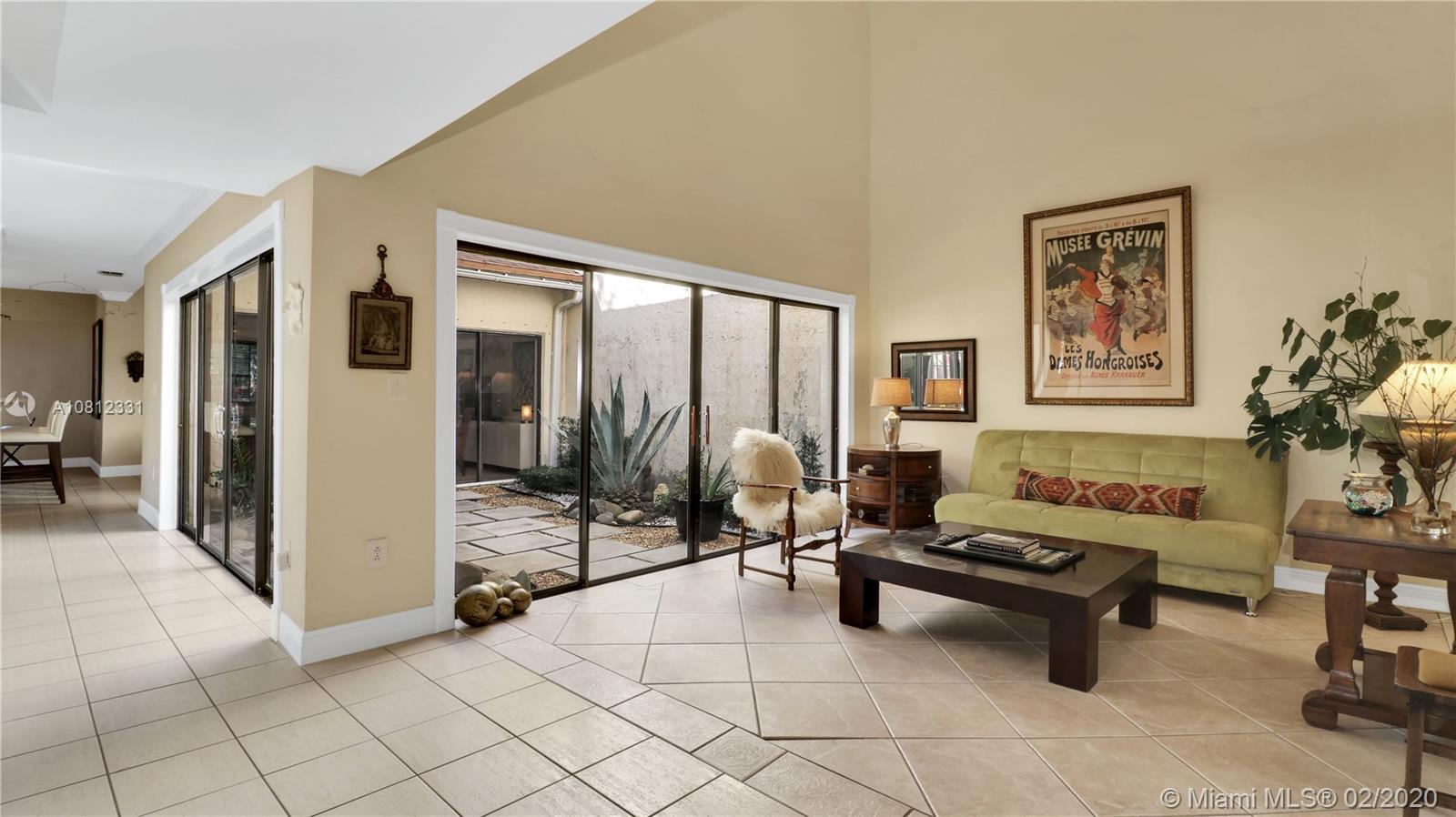 11339 Southwest 74th Terrace Miami, FL 33173 - Photo 6 of 31 LIVING ROOM WITH FULL OF VIEW ATRIUM