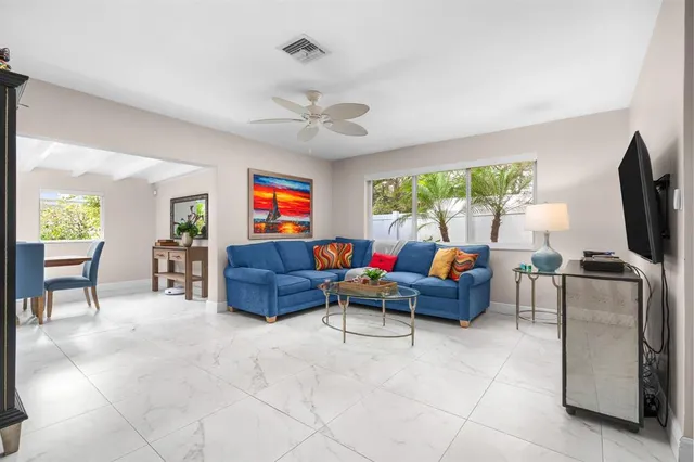 a kitchen with stainless steel appliances granite countertop a refrigerator and a stove
