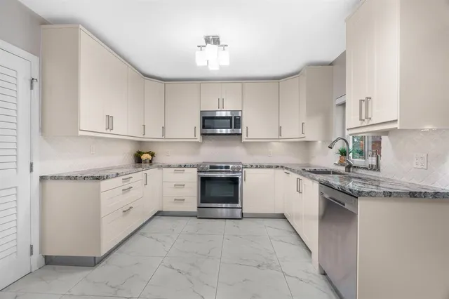 a bedroom with a large bed and a television