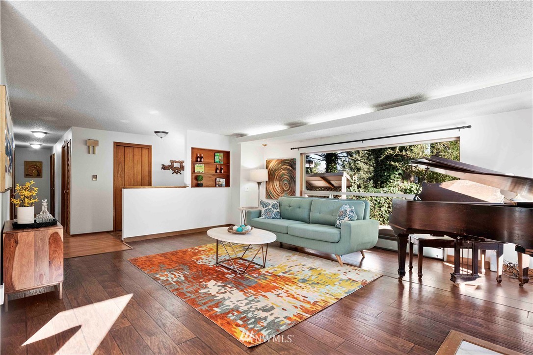 23718 23rd Avenue West Bothell, WA 98021 - Photo 13 of 36 a living room with furniture and a wooden floor