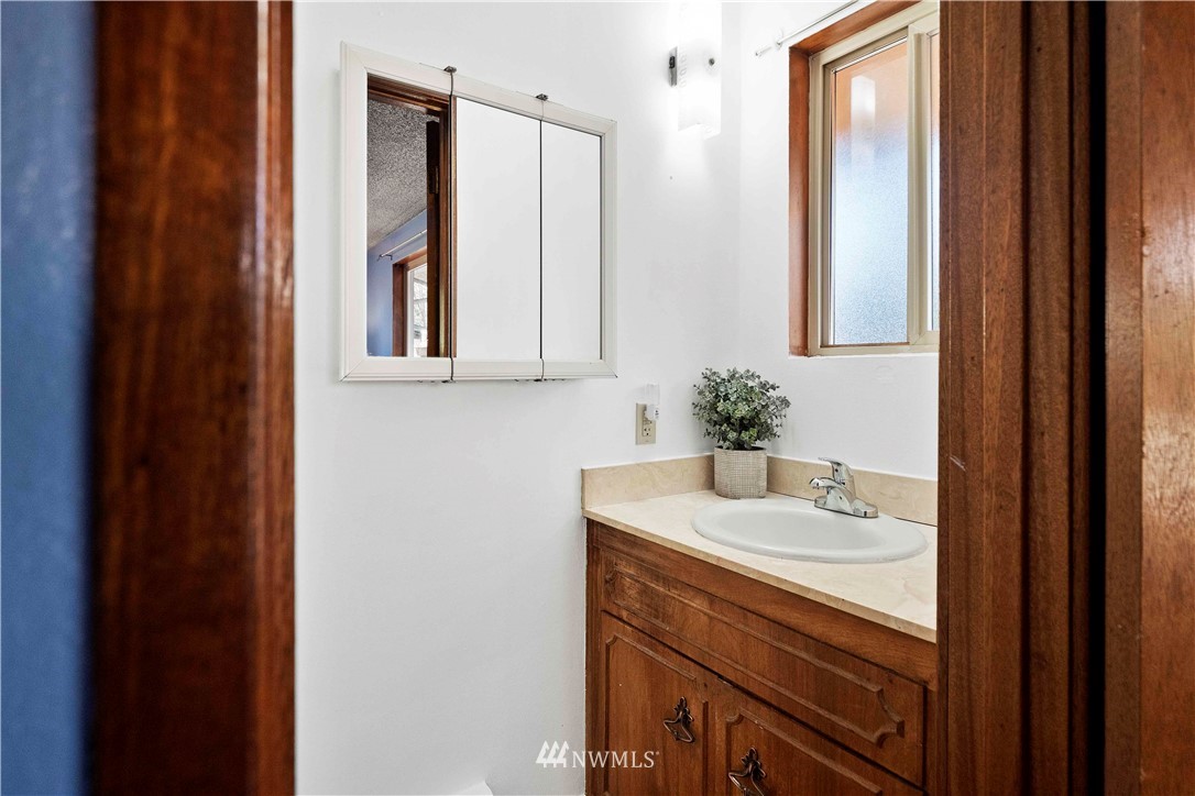 23718 23rd Avenue West Bothell, WA 98021 - Photo 16 of 36 a bathroom with a sink and a mirror