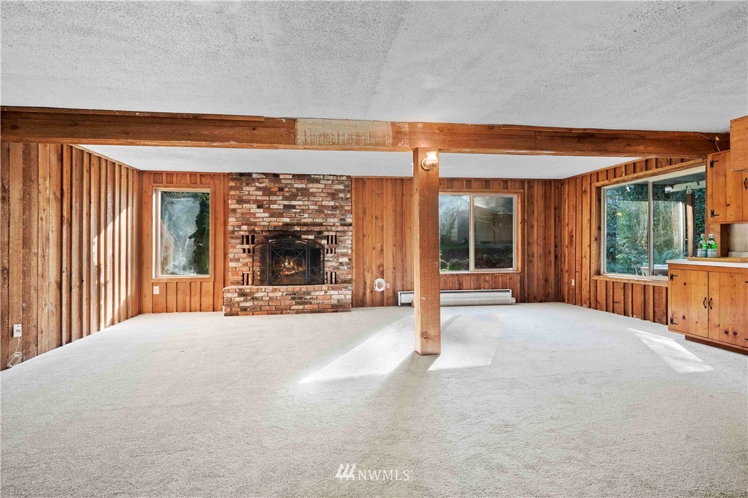 23718 23rd Avenue West Bothell, WA 98021 - Photo 20 of 36 a view of an empty room with a fireplace and a window