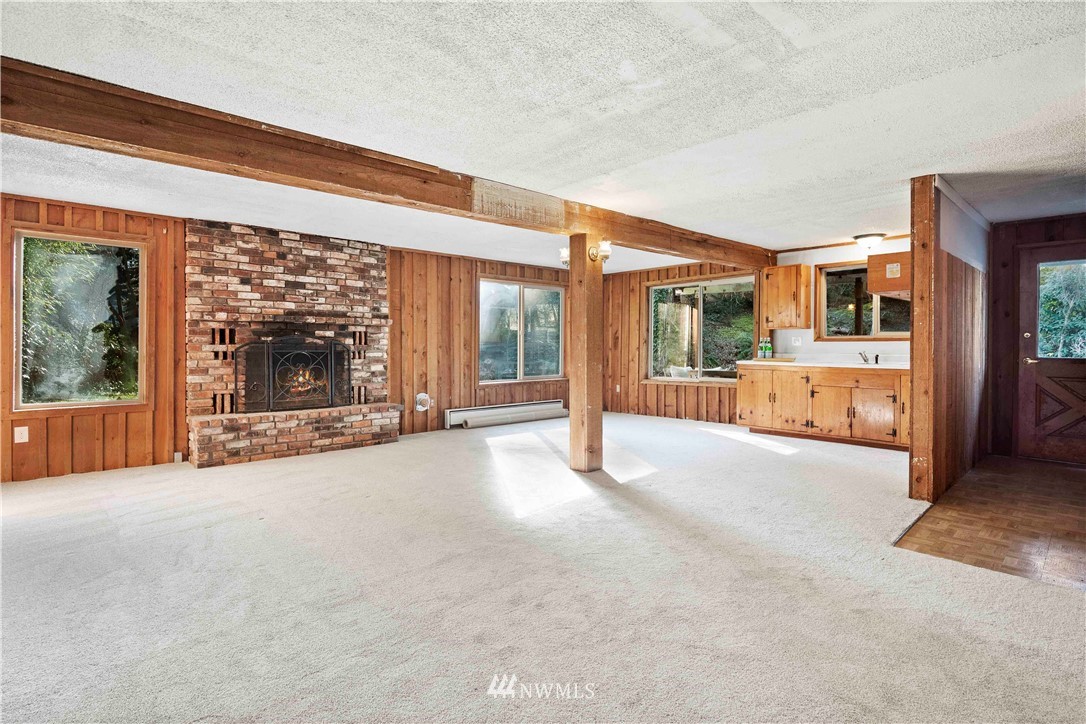 23718 23rd Avenue West Bothell, WA 98021 - Photo 21 of 36 a view of an empty room with a fireplace and a window