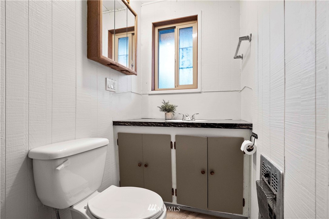 23718 23rd Avenue West Bothell, WA 98021 - Photo 24 of 36 a bathroom with a toilet a sink and mirror