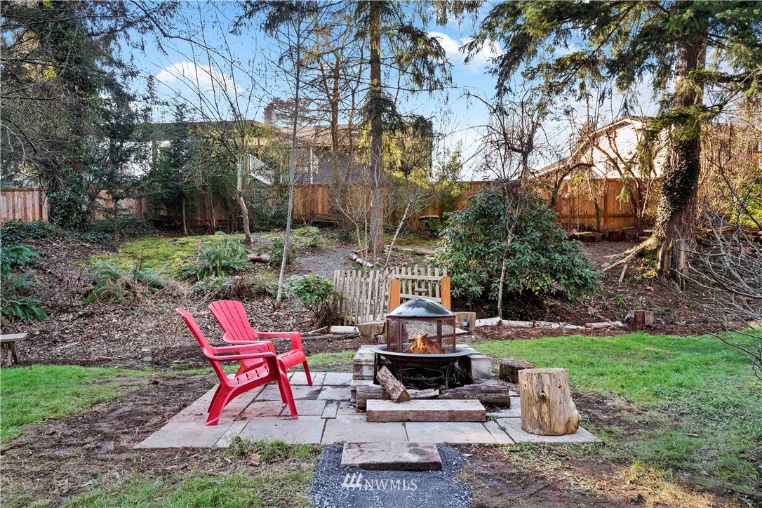23718 23rd Avenue West Bothell, WA 98021 - Photo 27 of 36 a view of a table and chairs in backyard of the house