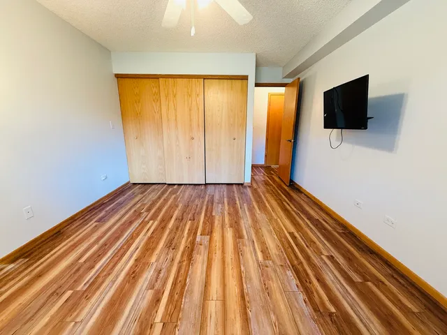 a view of a room with wooden floor and balcony