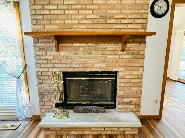 a fireplace with a wooden floor