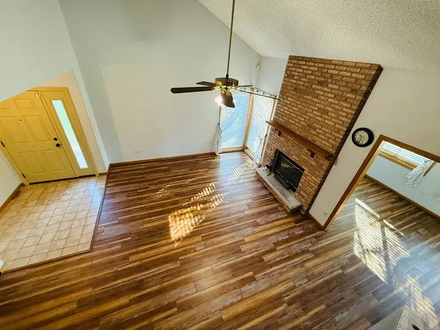 a view of a hardwood floor and staircase