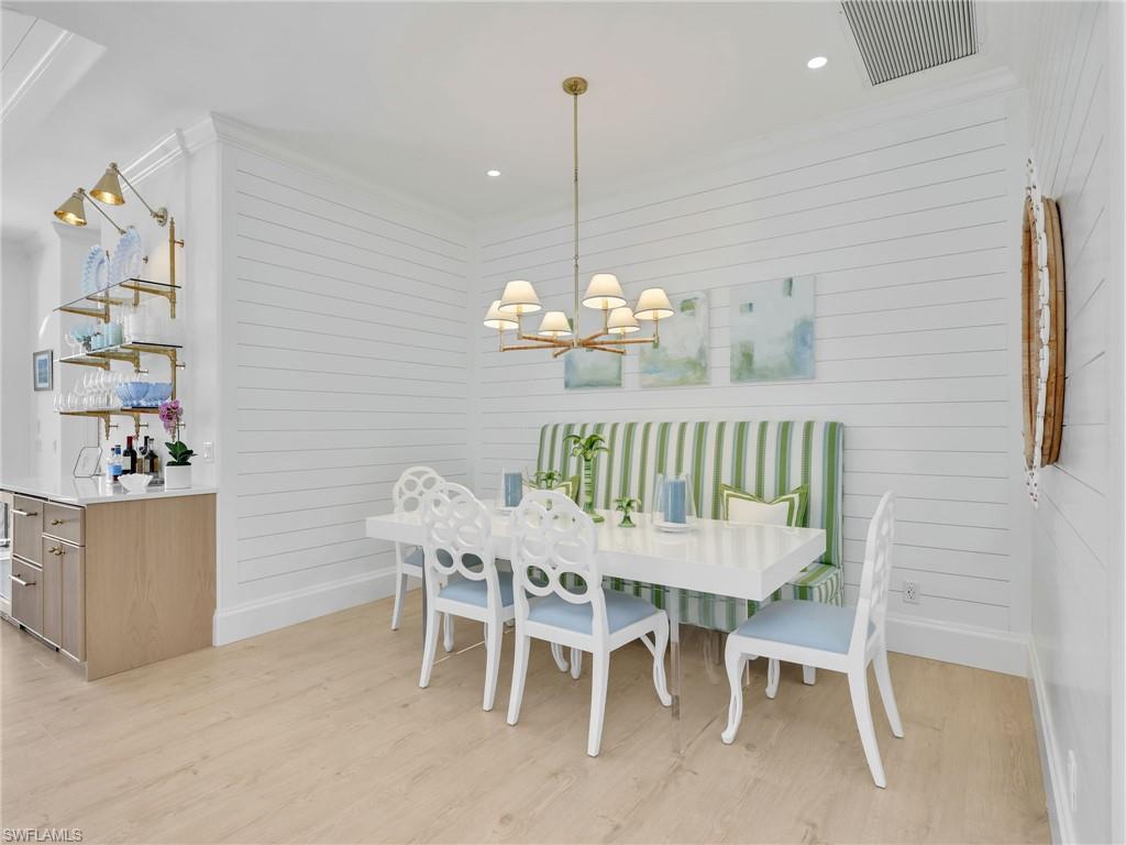 4304 Kensington High Street Naples, FL 34105 - Photo 12 of 40 a view of a dining room with furniture