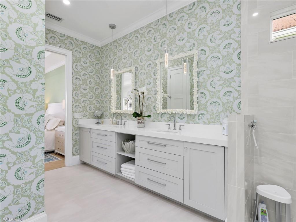 4304 Kensington High Street Naples, FL 34105 - Photo 22 of 40 a bathroom with a double vanity sink mirror and double