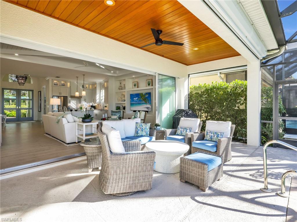 4304 Kensington High Street Naples, FL 34105 - Photo 27 of 40 a living room with furniture and a large window